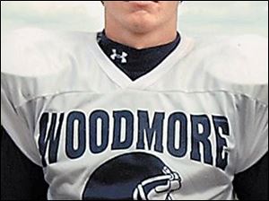 Tyler Rosenberger, the SLL's leading scorer last season in basketball, directs Woodmore's pass-oriented offense.