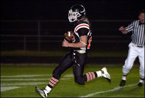 Otsego's Luke Donald scores one of his four touchdowns last night.