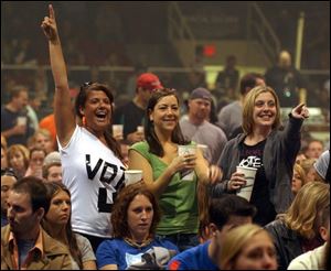 Fans at the Toledo Sports Arena cheer on the ban Death Cab for Cutie yesterday during the Vote for Change Tour that mixes music and politics.