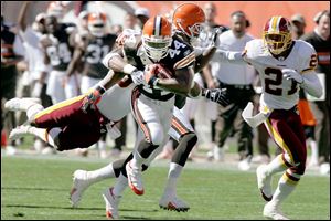 Lee Suggs, who made his first appearance of the season at running back for the Browns, breaks loose in the fourth quarter.
