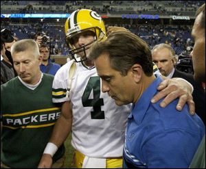 After moving up on the career lists in a couple categories, Green Bay's Brett Favre tried to comfort Lions coach Steve Mariucci.