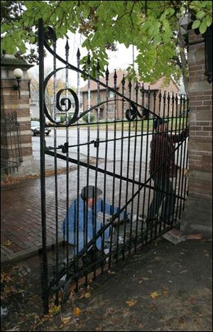 Rov gate  2 ,jpg Dan Barczak of Gallivant Forge, (419 242 3838) and Todd Liedel of Blissfield mich install a new gate they fabricated,  at Birkhead place, after the old one was hit by a car.  blade photo by herral long 10/2004