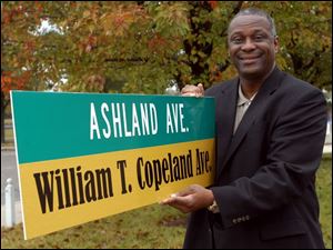 Cty Photo by Don Simmons Oct 20, 2004  Michael Ashford  Toledo City Councilman with the William T. Copeland street sign    ( copeland20p )