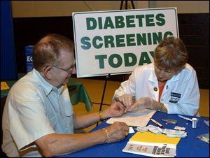 Nbr Photo by Don Simmons Oct 9, 2004   L to R   Ricahrd Warnke of Holland  is getting  his blood sugar check by Irene Brooks RN CDE at the senior health fair held at  WPOS FM radio station on Angola Rd