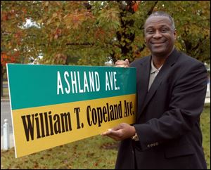 Cty Photo by Don Simmons Oct 20, 2004  Michael Ashford  Toledo City Councilman with the William T. Copeland street sign    ( copeland20p )
