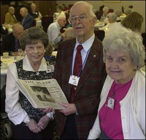 Residents Margaret Schneider, Al Foster, and Esther Krabill celebrate the Blade delivery system that has earned $51,000 for improvements at the South Toledo retirement complex.