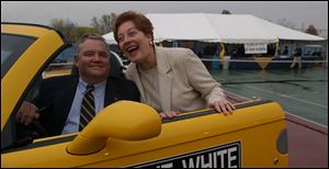 IN HIGH GEAR: Ted and Suzi Hahn have some high-octane fun prior to the UT-CMU game.