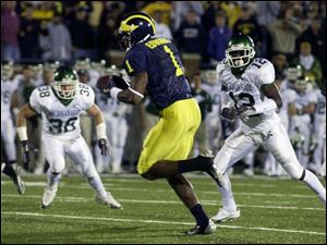 Braylon Edwards' 24-yard touchdown reception - his third of the game - put Michigan ahead to stay in the third overtime.