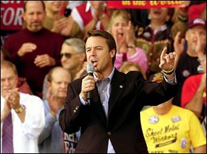 Vice presidential candidate John Edwards addresses a crowd of about 1,000 at the Ohio National Guard Armory in Marietta, Ohio. The Democrat talked mostly about domestic concerns.