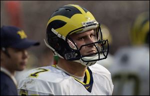 A glum Chad Henne was unable to become the first true freshman quarterback to lead his team to a win in this series.
