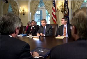 Cincinnati congressman Rob Portman seats to President Bush's left at a June 27, 2001, meeting in the Cabinet Room during a discussion on the Patient's Bill of Rights.