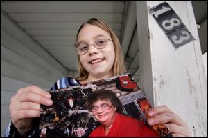 Jenna Pierson of Sherman Elementary School holds a photo of her grandmother. Jenna is thankful for firefighters who came to the rescue a few years ago when her grandmother had trouble bleeding.