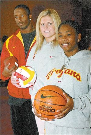 From left, Fred Davis, Sarah Florian and Jazlyn Davis, have adjusted to life 2,200 miles from home. They're attending Southern Cal on scholarships for football, volleyball and basketball, respectively. Florian is starting, Jazlyn Davis is injured and Fred Davis is waiting impatiently.