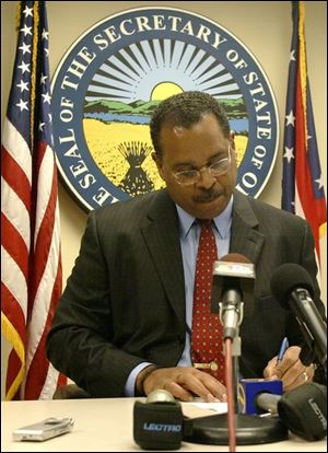 Ken Blackwell signs the official certification of the Nov. 2 election results, which give Mr. Bush Ohio's 20 electoral votes.