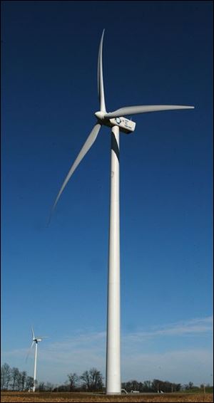 Giant windmills west of Bowling Green generate electric power for some of the 1,560 homes in the service area.