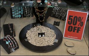 Bargains such as 50-percent-off jewelry attracted shoppers to stores. Nationwide, retailers drastically reduced their prices with the hope of padding out their bottom lines after what appears to be a lackluster holiday sales season.