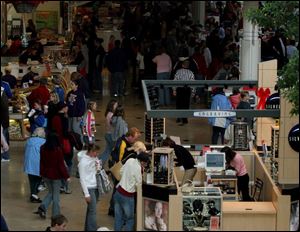 At Westfield Shoppingtown Franklin Park, shoppers flock to take advantage of day-after-Christmas sales.