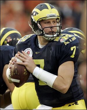 Michigan freshman Chad Henne hit 18 of 34 passes for 227 yards and a Rose Bowl record-tying four touchdowns.