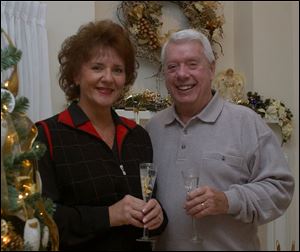 TOAST: Joyce and Bill Rimmelin host and toast the new year in their Sylvania home.
