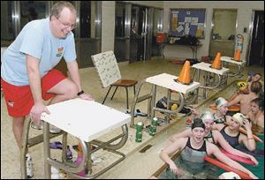 Dave Stannert conducts practice at the South Toledo YMCA.