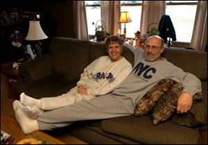 Cathi and Russ Bohland relax in their sweats on a Saturday afternoon. Mrs. Bohland is wearing the 'Grandpa' shirt she had given to her father.