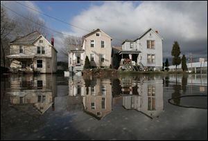 Flooding along First Street in Marietta threatens homes. Up to 400 residents in the area moved to a shelter.