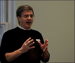 The Rev. Dirk Ficca, head of the Council for a Parliament of World Religions, speaks to an interfaith gathering in Toledo.