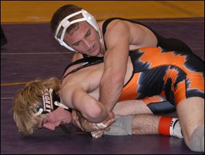 Delta's Jamison Moss controls Ashland's Brent Weisenstein in the 145-pound championship match at the Mary Kerr Memorial Invitational Tournament at Waite. Moss won by a pin.