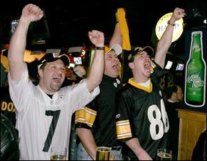 James Slagle, Mike Rose, and Bob Slemmer show their enthusiasm at Buffalo Wild Wings in Findlay as hometown hero Ben Roethlisberger leads the Steelers into the AFC title game.