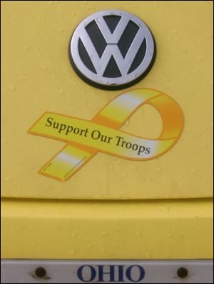FEA cars12p 2 A POW/MIA magnet on a Volkswagen Beetle. The Blade/Lori King