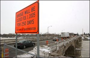 A sign alerts motorists to the impending bridge closure in Napoleon. The 75-year-old span will be demolished and rebuilt.