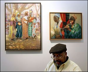 Artist Wil Clay with two of his paintings, Cameroon Market,
left, and Cameroon Music, at the 20 North Gallery.
