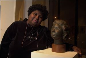 FAMILY ART: Karen Glover stands next to a sculpture of her mother, Mary Glover. The artwork was created by Karen's late father, LeMaxie Glover.