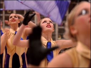 NBR drump05  Maumee winter guard Emily Burghardt practices with her flag team before competing on saturday afternoon at Waseon high school. the  The Blade/Kevin Nortz