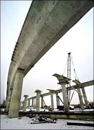 Assembly of the main spans of the precast concrete bridge has remained on hold since the collapse on Feb. 16, 2004.