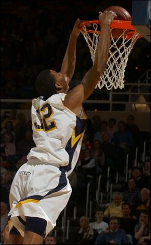 Toledo's Anton Currie slams in two of his team-leading 15 points. The Rockets improved to 8-5 in the MAC West Division race.