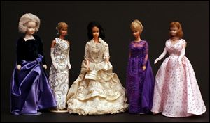 Barbie dolls are dressed to look like Barbara Bush, Nancy Reagan, Lucy Hayes, Hillary Clinton, and Mamie Eisenhower in a collection donated to the Hayes Presidential Center in Fremont.