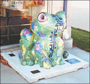 Enviro-Tech, a frog statue that was part of Toledo s  It s
Reigning Frogs  public art campaign four years ago, is
missing from its base on North Summit Street. 