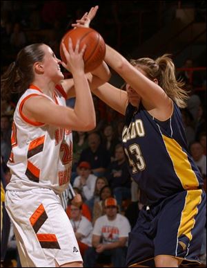 BG's Ali Mann shoots over Toledo's Savannah Werner on Saturday at Anderson Arena. The Falcons won in the last 10 seconds.