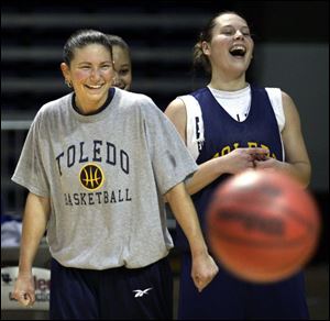 Amber Jacobs, left, and Danielle Bishop share a laugh in practice. Jacobs has helped the sophomore become Toledo's leading scorer. 