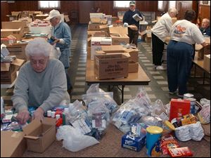 NBR collect01p 3 Lela Cook, of Pemberville, OH Freedom Auxiliary, sorts donated supplies to be boxed up for soldiers at Troy-Webster American Legion Post 240 in Luckey, OH Tuesday, March 1, 2005. The Blade/Lori King