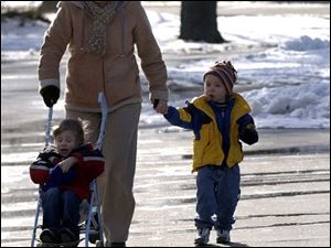 CTY  rove  Wildwood Preserve Metropark.  l-r  Carol Stewart , Toledo, takes her grandson Matthew Stewart 3(in stroller), Maumee, and his friend Austin Witty 3, for a walk Wednesday.  They go somewhere different once a week for what she calls "grandmothers day".  The Blade/Diane Hires