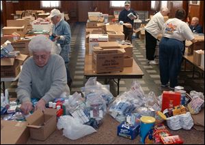 NBR collect01p 3 Lela Cook, of Pemberville, OH Freedom Auxiliary, sorts donated supplies to be boxed up for soldiers at Troy-Webster American Legion Post 240 in Luckey, OH Tuesday, March 1, 2005. The Blade/Lori King