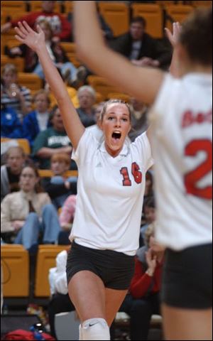 Bedford senior Kali Kuhl celebrates a point in
the fourth game of the Mules  semifinal victory.
