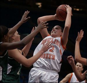 Ali Mann scores two of her team-leading 19 points yesterday at Gund Arena as Bowling Green defeated Eastern Michigan.