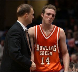 John Reimold is on the verge of tears at the end of his final game. Reimold led all MAC scorers with 18.5 points a game.