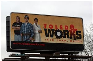 A Toledo Works billboard is located on the Anthony Wayne Trail north of the Toledo Zoo.

