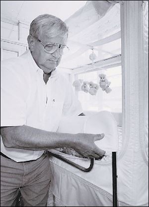 Bob Vail works on an older model in 1995. Federal marshals yesterday seized all finished models of the 500, 1000, and 2000 enclosed beds. CEO Joy Vail has insisted the product is safe.