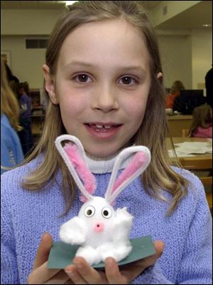 NBR  Metamora, Ohio.  hunt19p  Evergreen Community Library.  Taylor Monahan, 9, is proud of the bunny she made.  Diane Hires  3/19/05