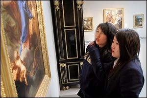 Yoshie Takahashi, left, and Erica Kimura view artwork at the Toledo Museum of Art.